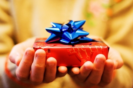 two hands with present