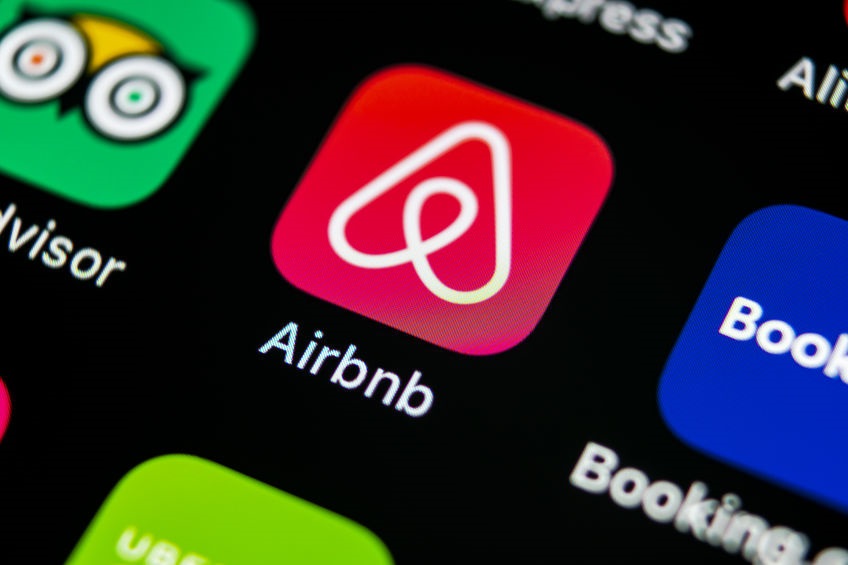 Airbnb application icon on Apple iPhone X screen close-up. Airbnb app icon. Airbnb.com is online website for booking rooms. social media network.